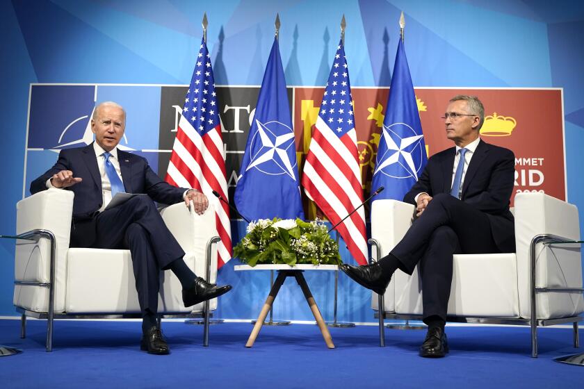 U.S. President Joe Biden, left, poses with NATO Secretary General Jens Stoltenberg during a meeting at the NATO summit in Madrid, Spain on Wednesday, June 29, 2022. North Atlantic Treaty Organization heads of state and government will meet for a NATO summit in Madrid from Tuesday through Thursday. (AP Photo/Susan Walsh)