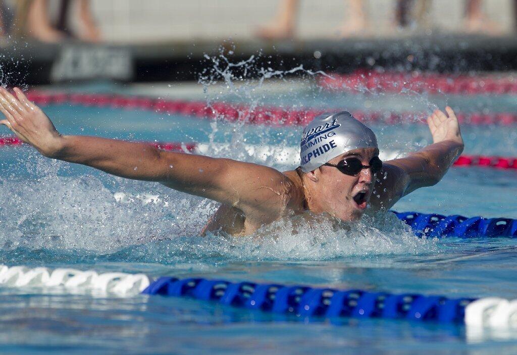 Newport Harbor High's Nick Halphide competes in the 100-yard butterfly against Los Alamitos.