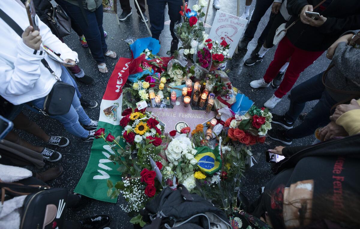 Vicente Fernández's star on Hollywood Boulevard is decorated by fans during a makeshift memorial.