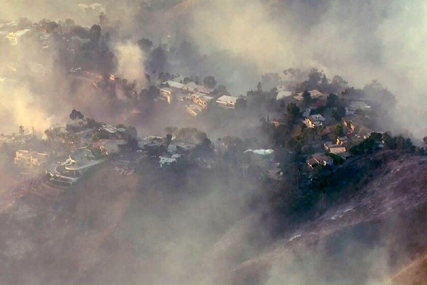 Aerial view of homes shrouded in smoke from the Getty fire.