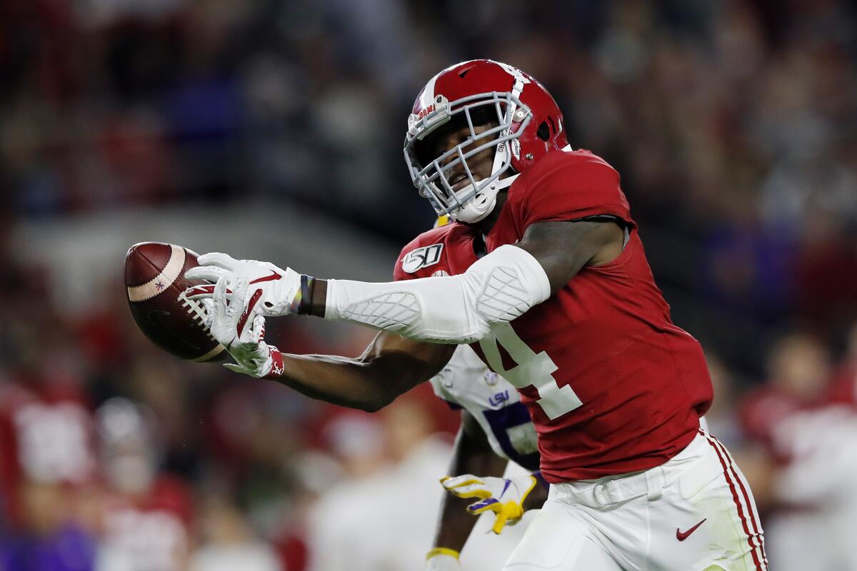 Alabama receiver Jerry Jeudy reaches for a pass against Louisiana State in November.