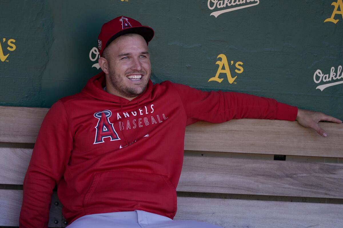 Angels star Mike Trout smiles in the dugout before a game against the Oakland Athletics on July 19.