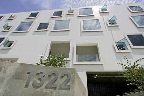 By David Hay Habitat 15, a new town house complex on Detroit Street in Los Angeles, has 27 windows of differing sizes, all placed in a seemingly random pattern across the 80-foot-long front facade. The effect is akin to a giant wall of flat-panel TVs, and according to Santa Monica architects Hadrian Predock and John Frane, the facade pays homage to the world of movies. "The building is in Hollywood after all," Predock said.