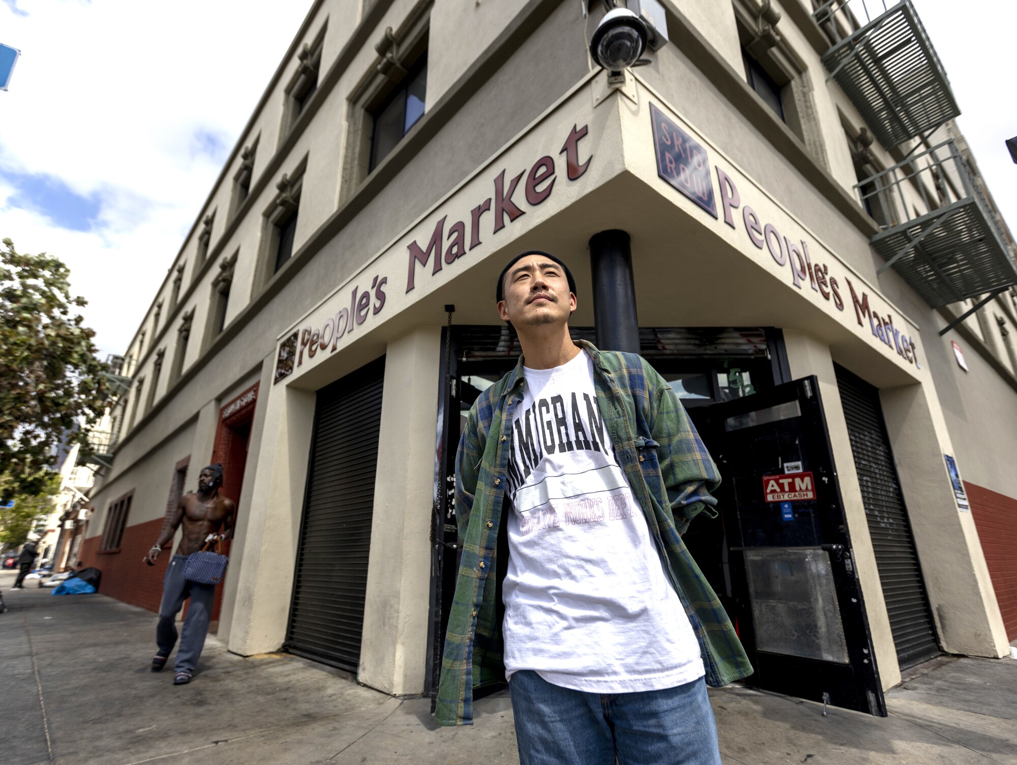 Danny Park stands in front of Skid Row People's Market in Los Angeles. 