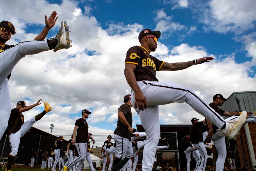 Peoria, AZ - February 21: Padres right fielder Jose Azocar (28) and teammates stretch during a spring training practice at the Peoria Sports Complex on Tuesday, Feb. 21, 2023 in Peoria, AZ. (Meg McLaughlin / The San Diego Union-Tribune)