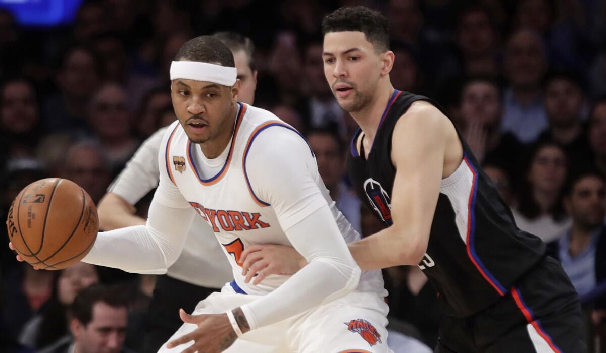 Clippers' Austin Rivers, right, tracks New York Knicks' Carmelo Anthony during the first half Wednesday.