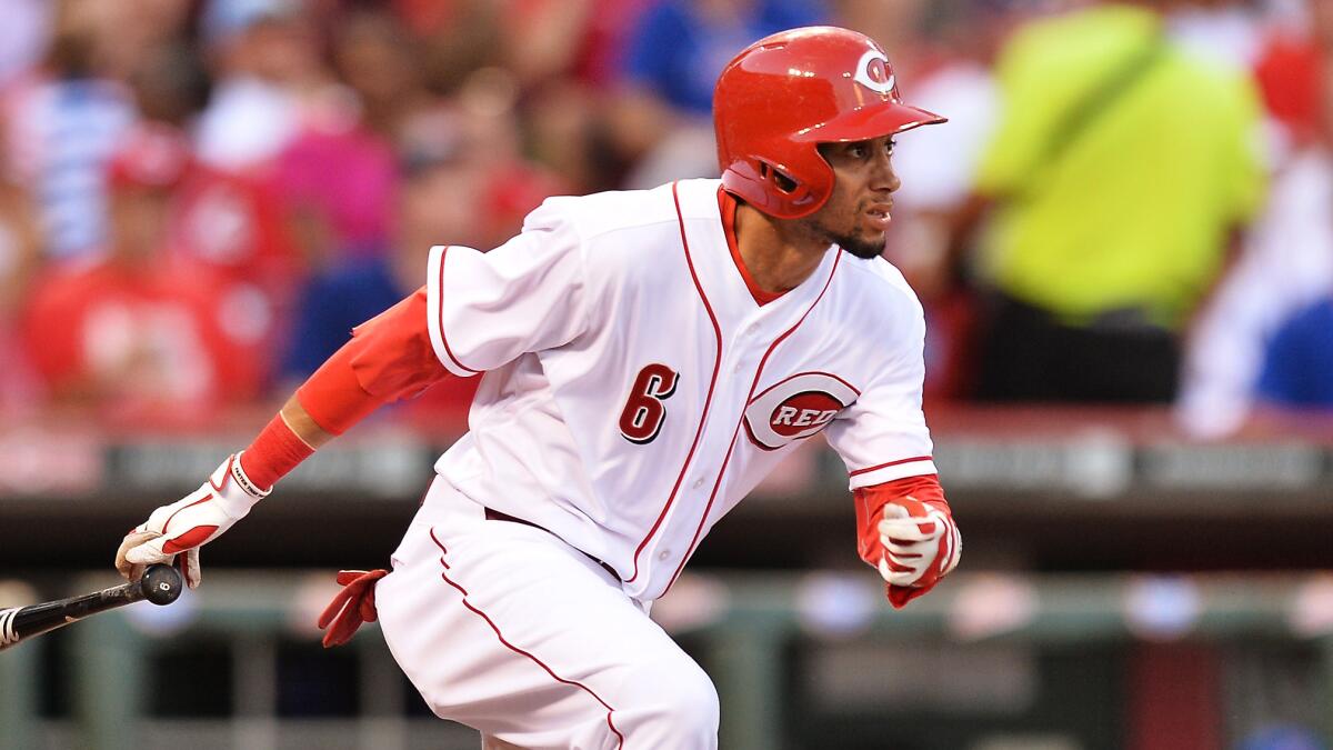 Cincinnati Reds rookie Billy Hamilton triples during a game against the Chicago Cubs on July 9.