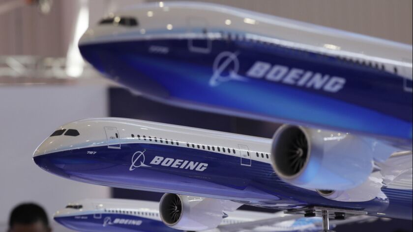 Models of a Boeing passenger airliner. Boeing Co. and other aerospace giants have made a number of acquisitions this year.