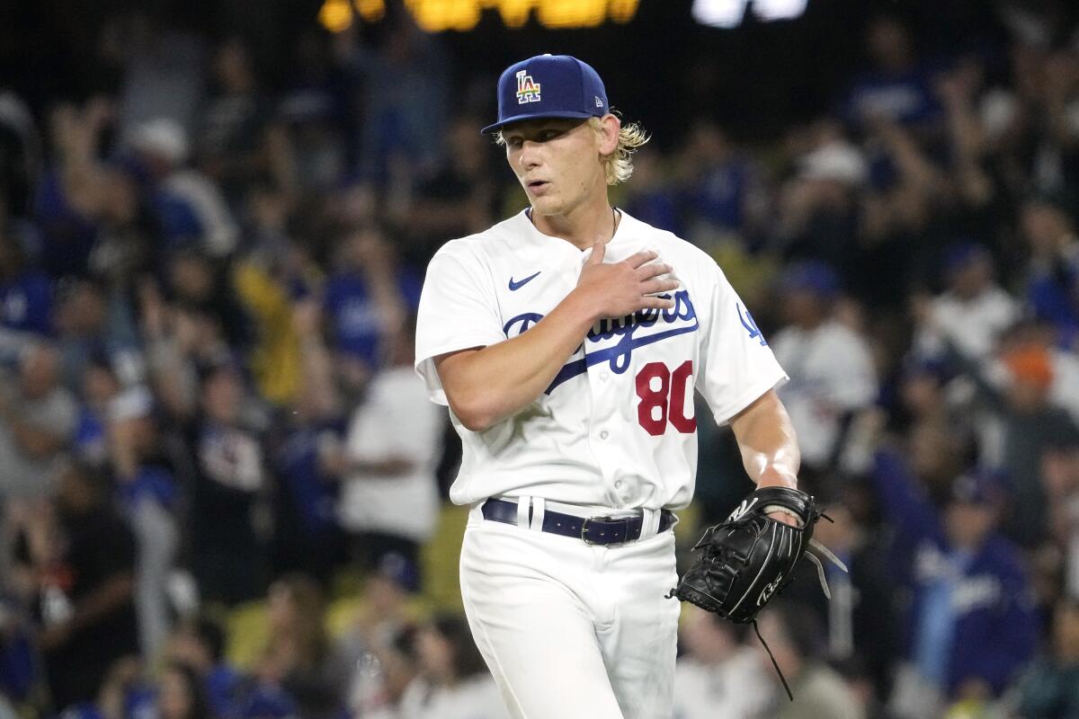 Dodgers starting pitcher Emmet Sheehan walks off the field after his first major-league start.