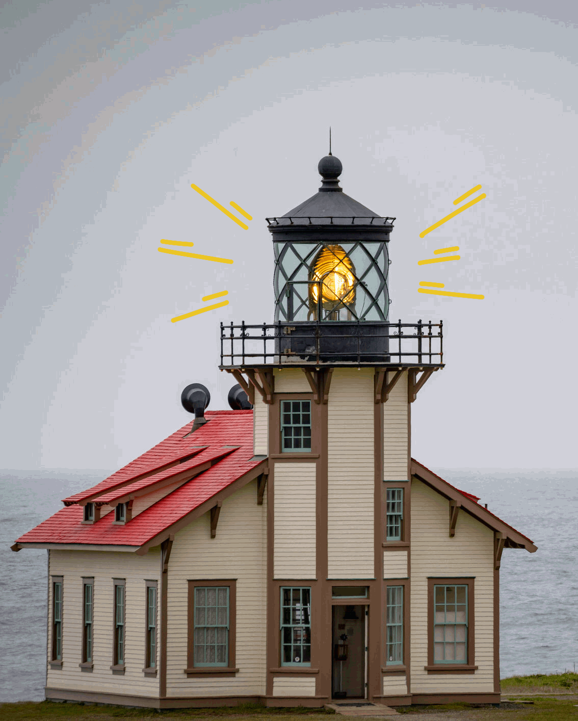A light station with animated rays beaming from the light in the tower.