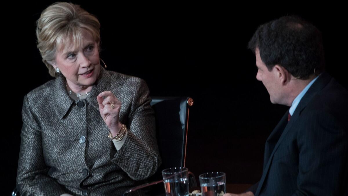 Clinton is interviewed on stage by Nicholas Kristof of the New York Times.