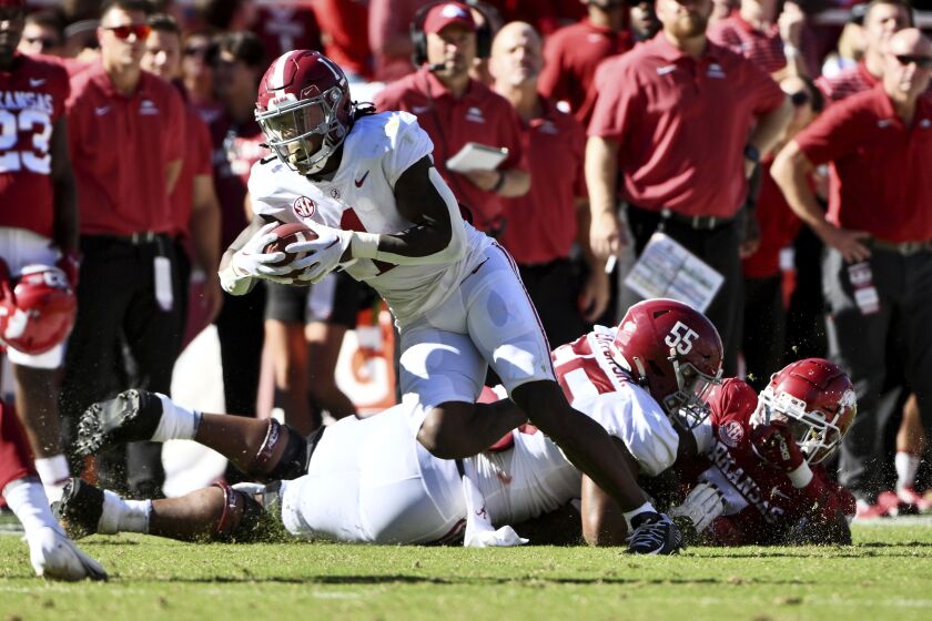 Alabama running back Jahmyr Gibbs (1) carries against Arkansas during the first half of an NCAA college football game Saturday, Oct. 1, 2022, in Fayetteville, Ark. (AP Photo/Michael Woods)