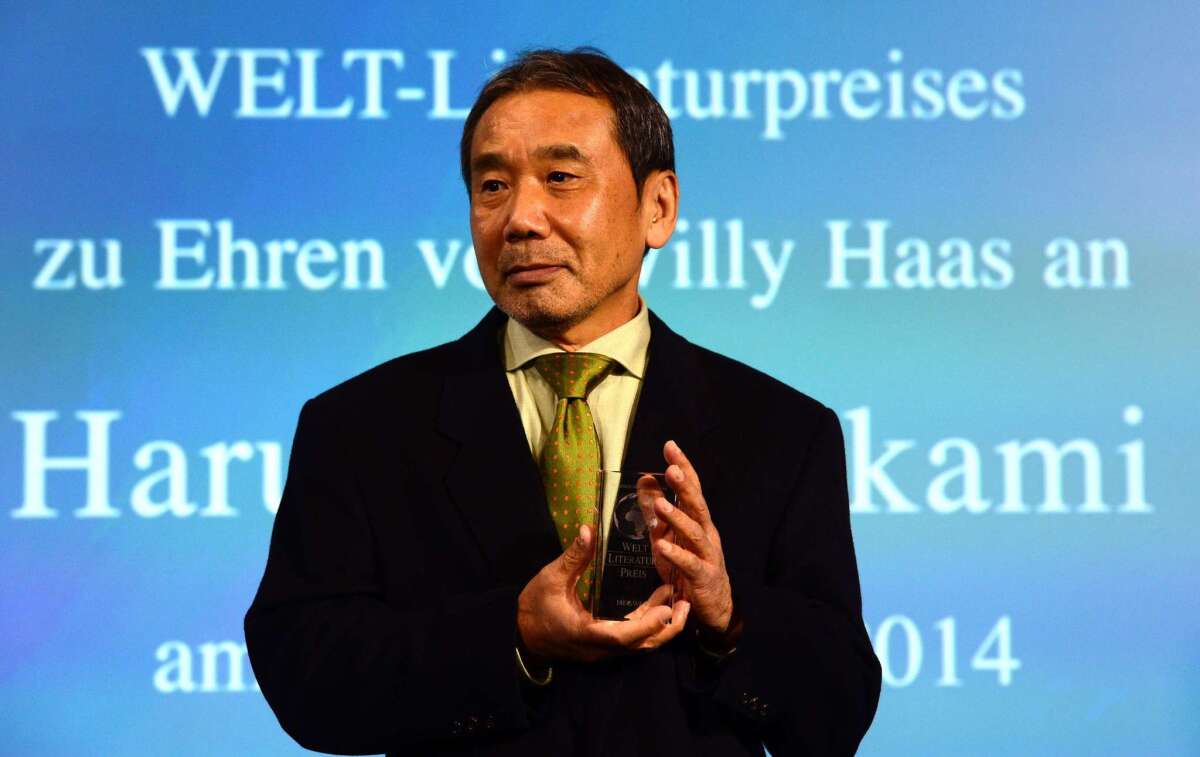 Japanese writer Haruki Murakami, shown accepting Germany's Welt Literature Prize in November, is going to write an online advice column.