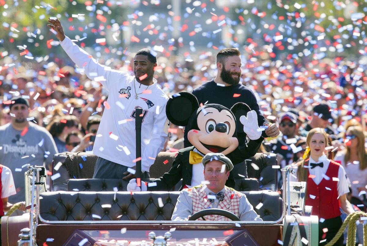 The Super Bowl parade in Boston definitely won't be as warm as the Patriots' parade on Monday at Disneyland park in Anaheim, Calif.