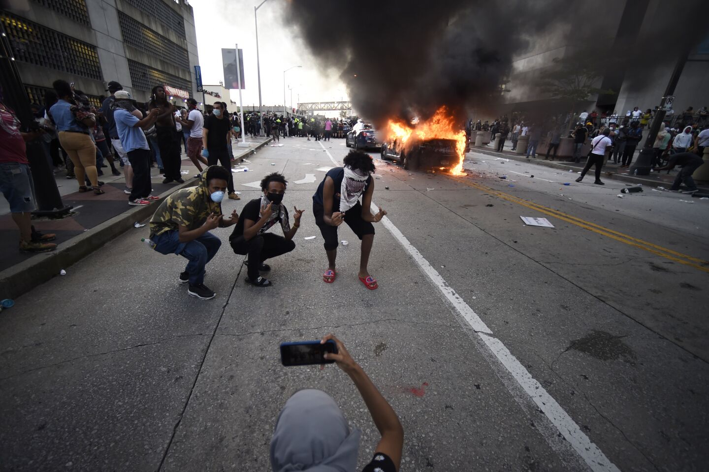 An Atlanta Police Department vehicle burns in a protest Friday.