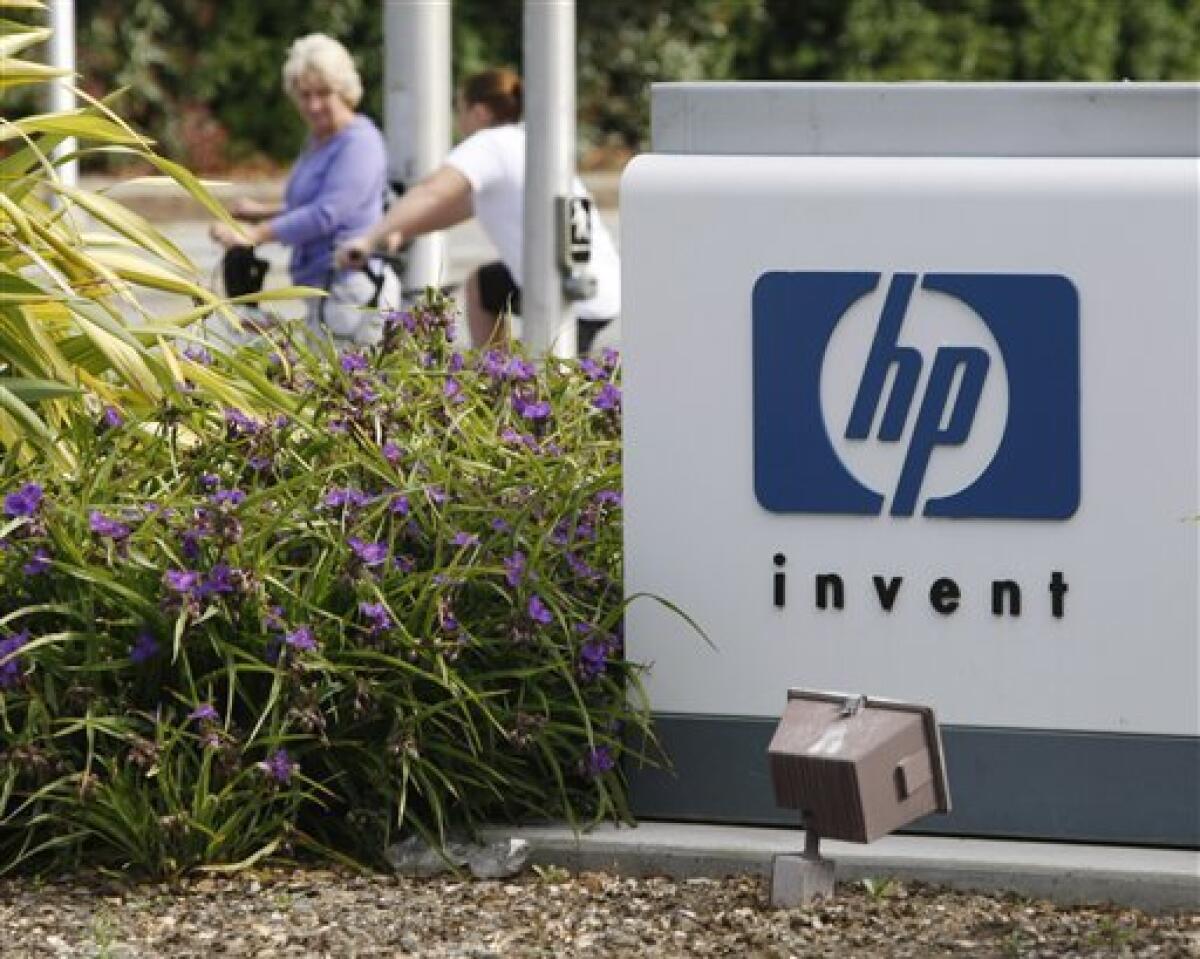 Workers arrive on bikes in front of Hewlett Packard Company headquarters in Palo Alto, Calif., Tuesday, June 1, 2010. HP said Tuesday it will lay off about 9,000 workers in the unit that provides technology services to other businesses as the company consolidates and automates its commercial data centers. The cuts will be made over about three years and amount to some 3 percent of HP's global work force. (AP Photo/Paul Sakuma)