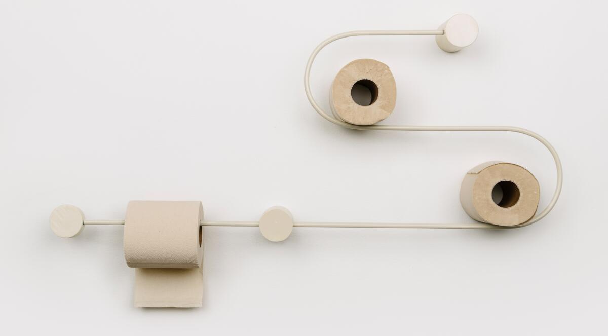 Theo Martins' bent-steel design offers storage for extra rolls of toilet paper.