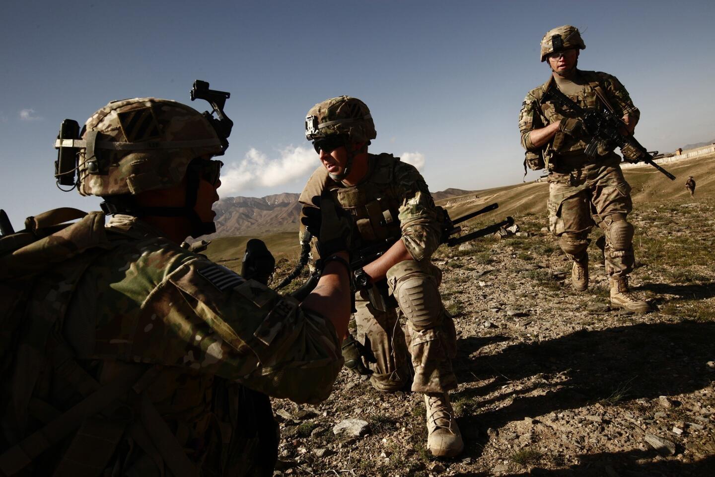 Sgt. Christopher Lee, 23, of Beverly Hills, left, Pvt. Tyler Hartzheim, 20, of the Palos Verdes Peninsula and other soldiers of Bravo 3-15 are helping the Afghan military prepare to take over security responsibilities.
