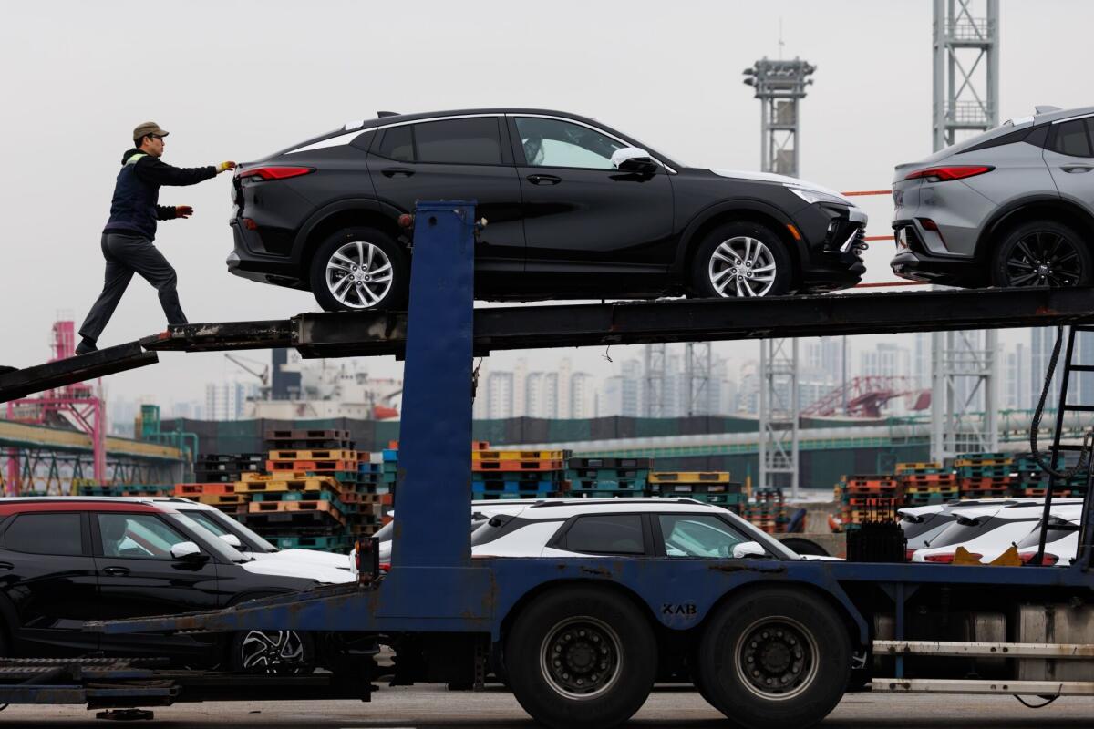 GM's Buick vehicles unloaded on a trailer truck at the Port of Incheon in South Korea.