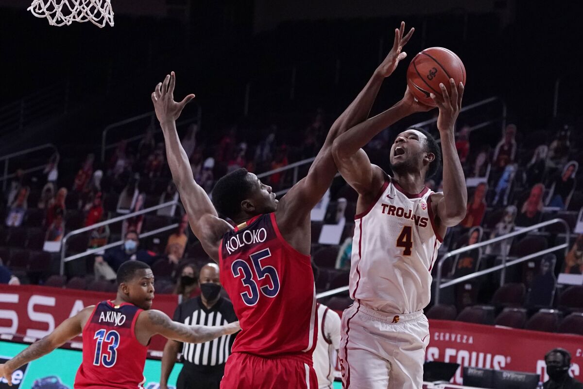 USC's Evan Mobley goes up for a shot against Arizona's Christian Koloko in the second half Feb. 20, 2021.