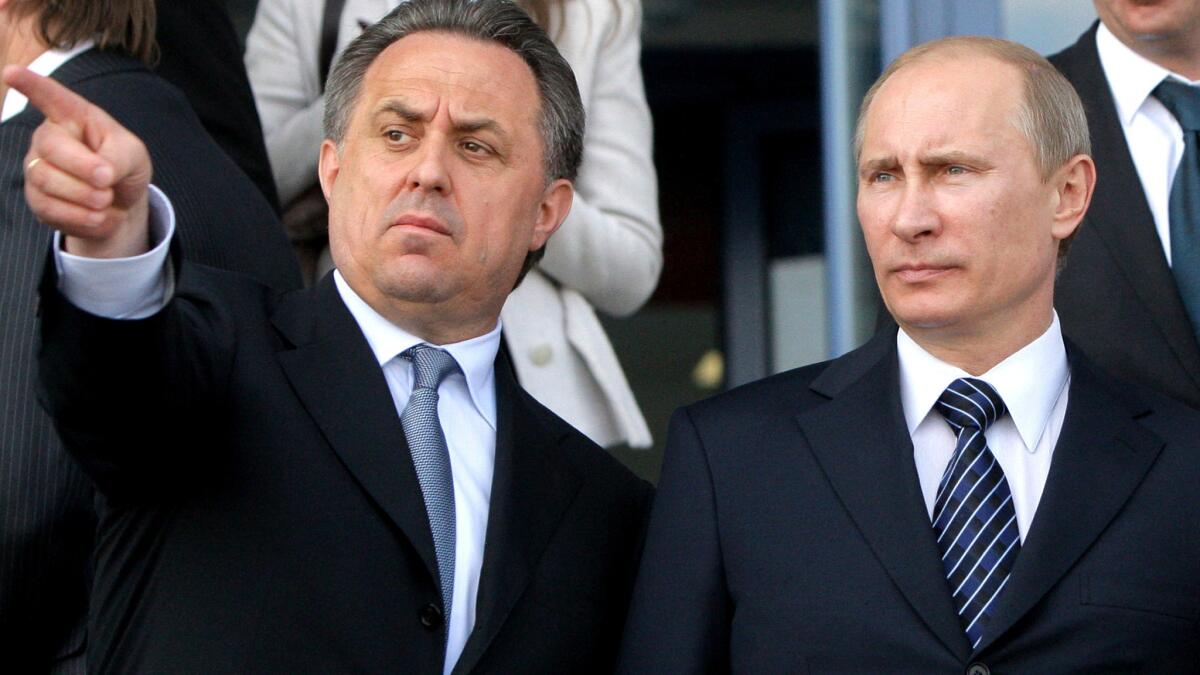 Vitaly Mutko, then Russia's sports minister, and Prime Minister Vladimir Putin visit a complex under construction at the time before the 2012 Sochi Olympics.