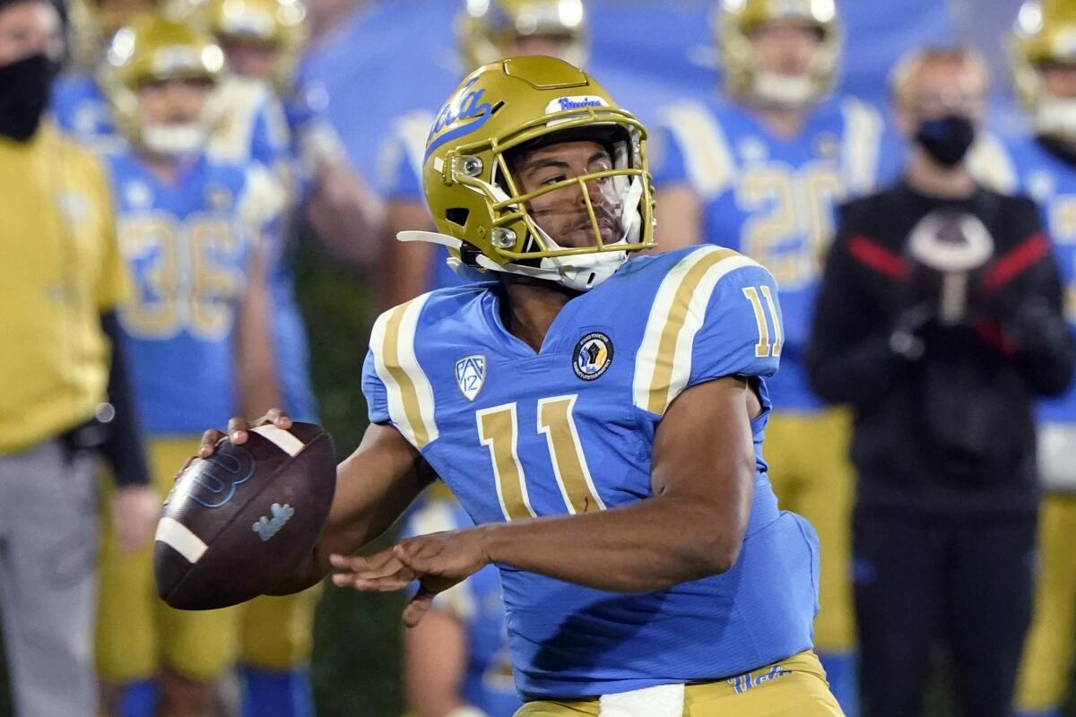 UCLA quarterback Chase Griffin looks for a receiver during the second half against Arizona on Nov. 28, 2020.