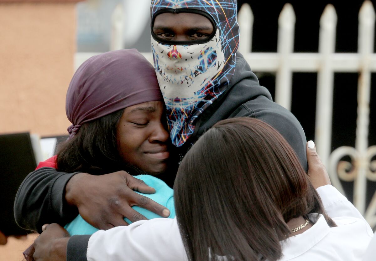 Relatives and friends of Dijon Kizzee gather in Westmont near where he was fatally shot by sheriff's deputies.