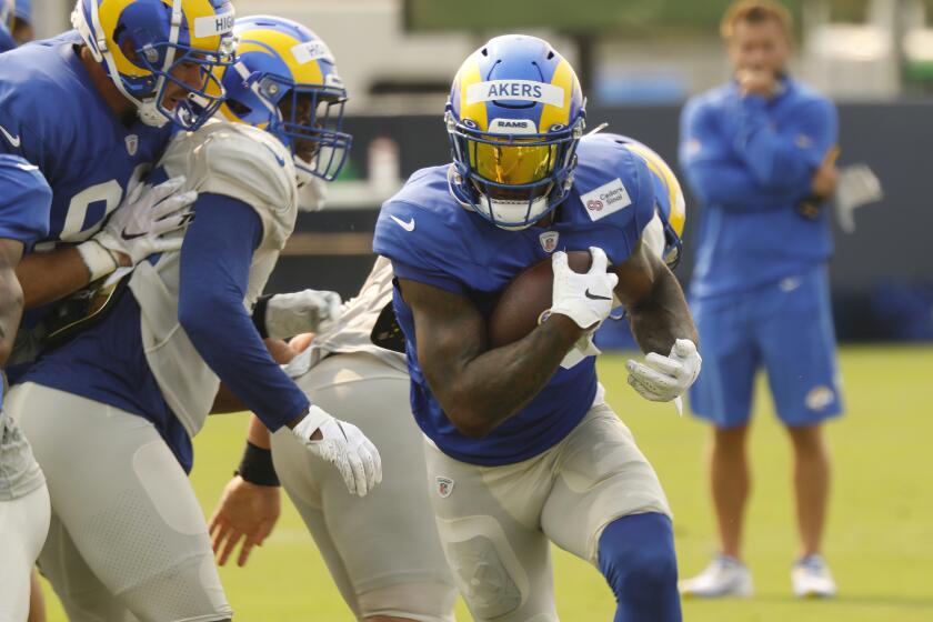 Los Angeles Rams rookie running back number 23 Cam Akers runs a play.