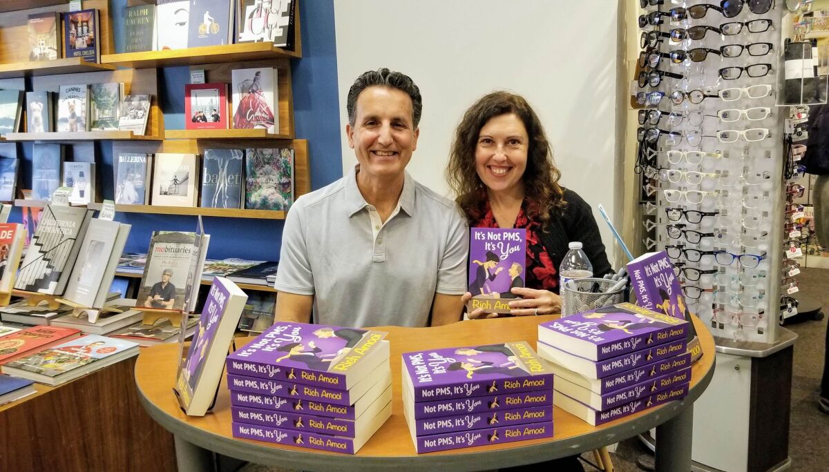 Author Rich Amooi and his wife, Silvi Martin, at a book signing at Warwick's in La Jolla.