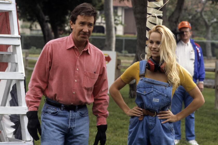 HOME IMPROVEMENT - "The Great Race" - Airdate: May 19, 1993. (Photo by ABC Photo Archives/Disney General Entertainment Content via Getty Images) TIM ALLEN;PAMELA ANDERSON