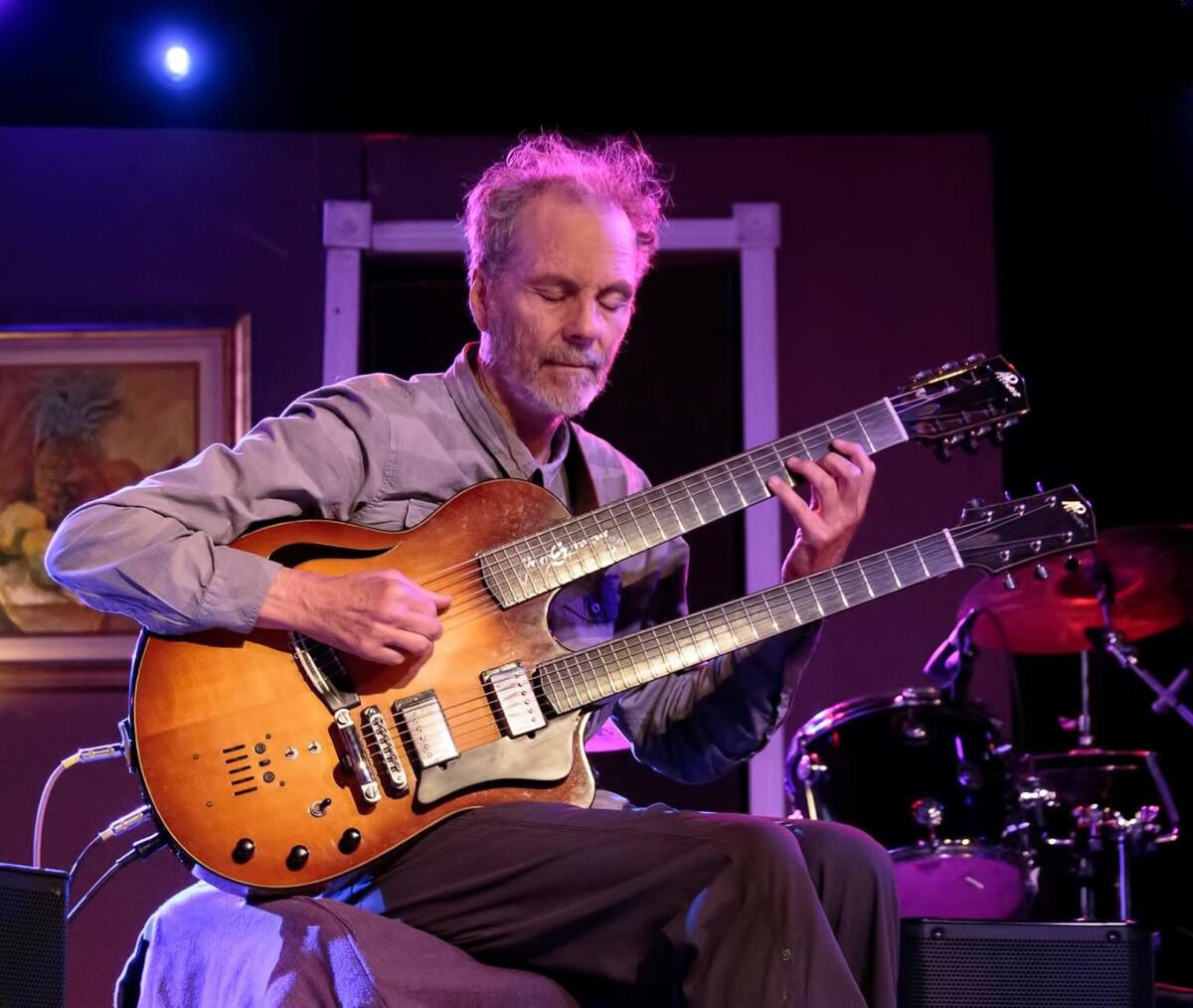 Guitarist Peter Sprague designed a two-neck guitar with both nylon and steel strings that he will play Dec. 24 in Del Mar.