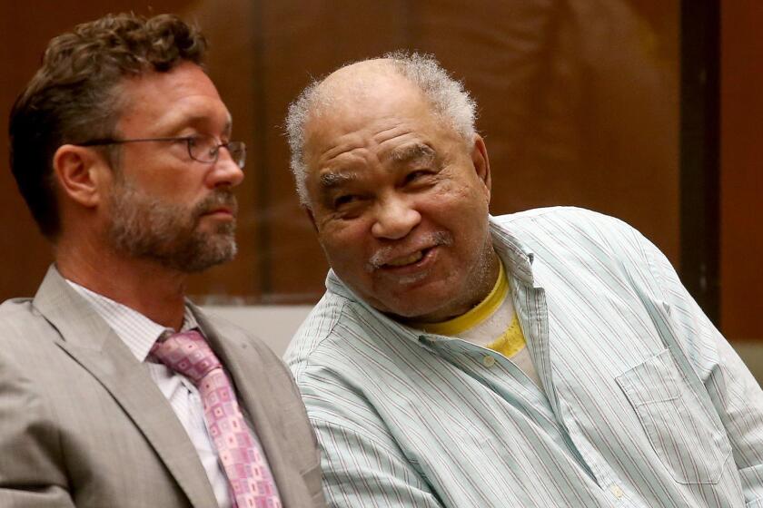 LOS ANGELES, CLIF. - SEP. 2, 2014. Samuel Little, right, appears unfazed after being convicted on three counts of first degree murder on Tuesday, Sept. 2, 2014, in Los Angeles Superior Court. Little is believed to be tied to several other homicides of women in South Los Angeles in the 1980s. With him is public defender Michael Pentz. (Luis Sinco/Los Angeles Times)