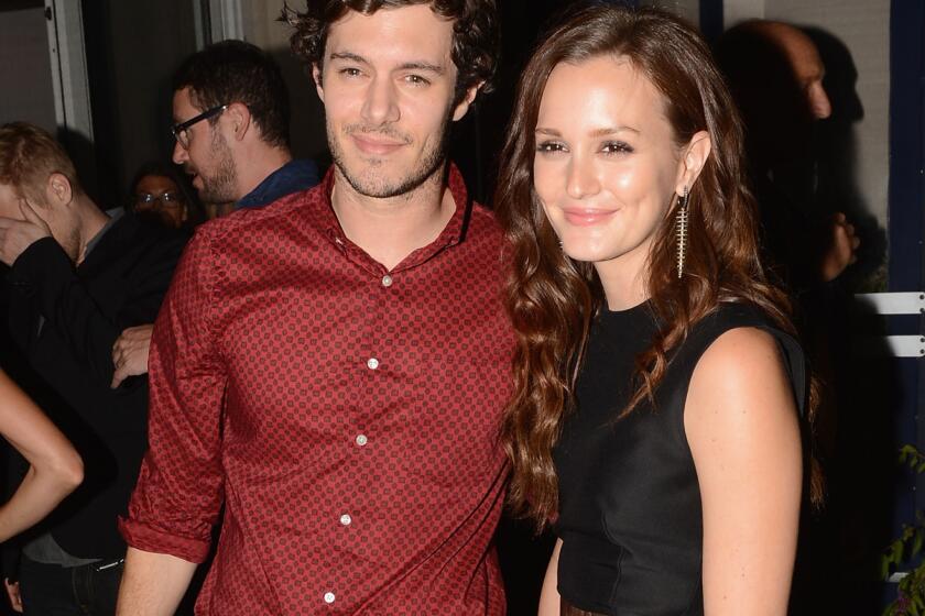 Adam Brody and Leighton Meester are reportedly engaged. In this photo, the couple are shown attending the afterparty of the screening of their film "The Oranges" at Jimmy's at James Hotel in New York City.