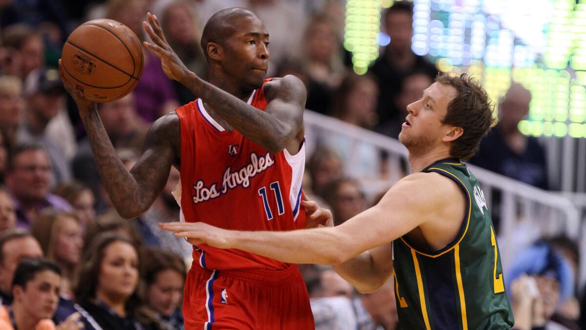 Clippers point guard Jamal Crawford, left, looks to pass over Utah Jazz forward Joe Ingles during the Clippers' 112-96 win Nov. 29.