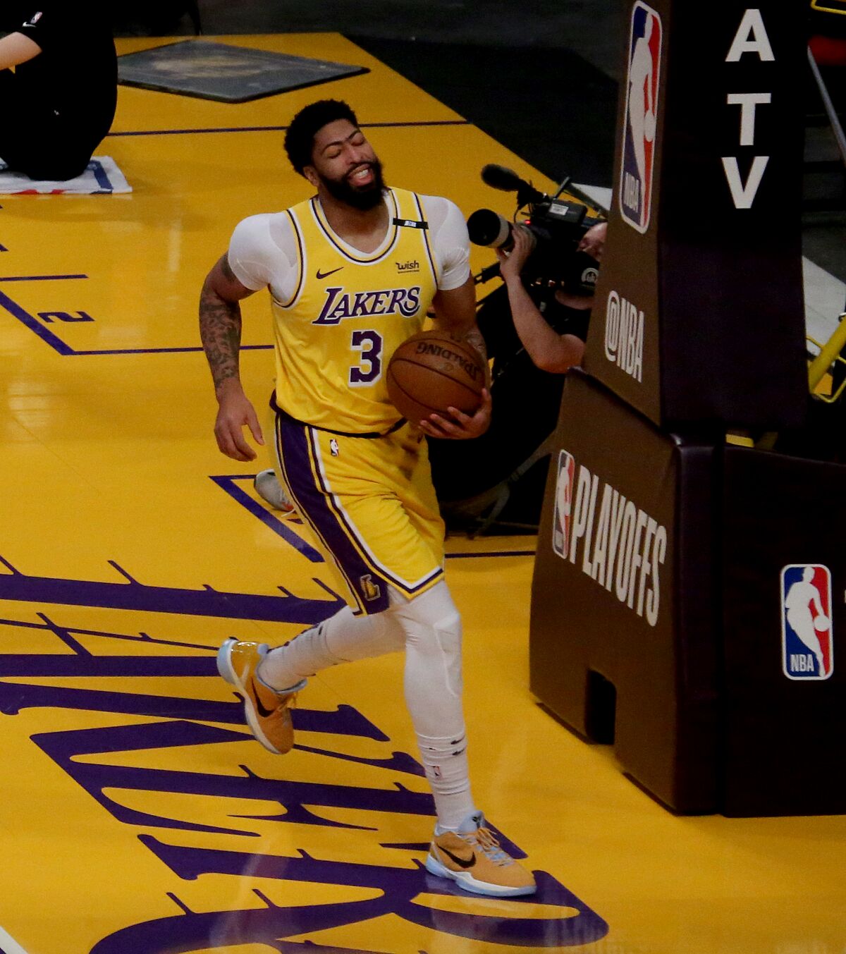 Lakers forward Anthony Davis winces in pain early in Game 6 against the Suns 