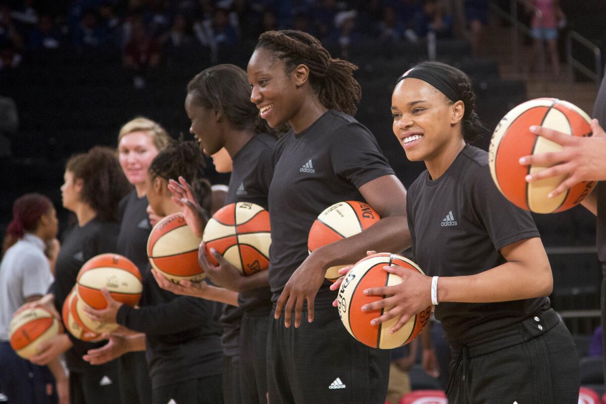 Members of the New York Liberty await the start of a game against Atlanta on July 13.
