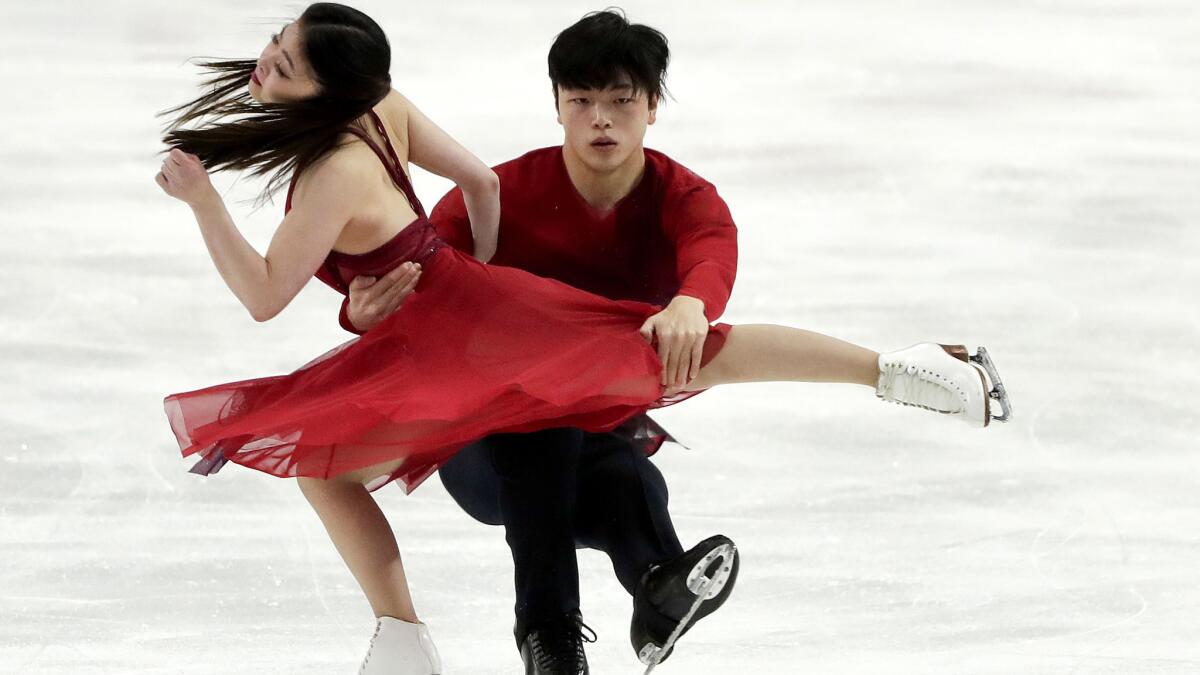 Siblings Maia and Alex Shibutani perform their ice dance during the free dance Sunday at Skate America.