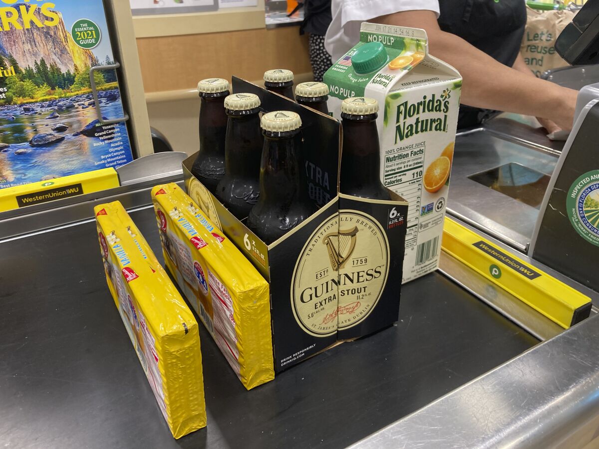 Groceries on a checkout counter at a grocery store