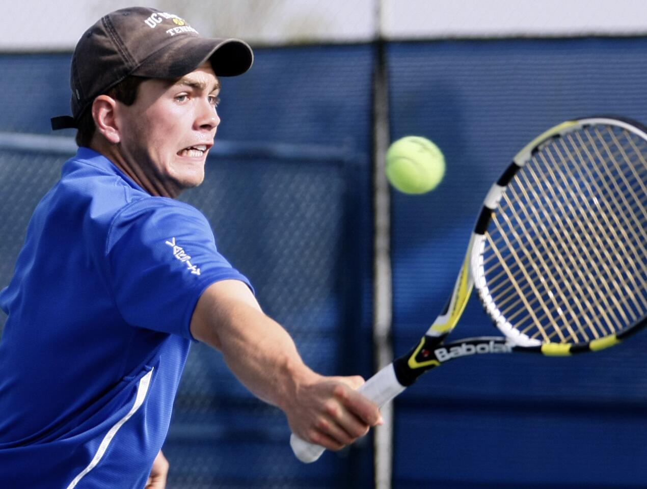 San Marino High School's tennis player James Wade returns the ball during doubles match at home vs. La Canada High School in San Marino on Thursday, March 28, 2013.