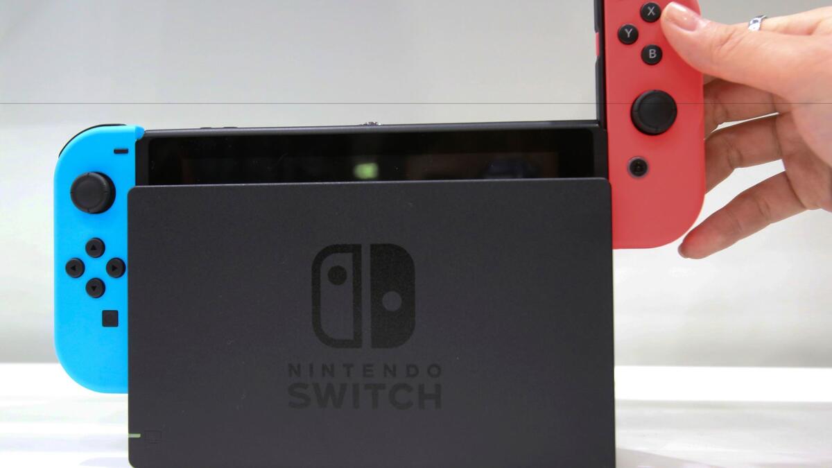 The Nintendo Switch, shown in its dock.