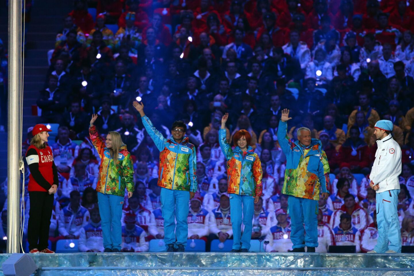 Volunteers are recognized during the 2014 Sochi Winter Olympics Closing Ceremony.
