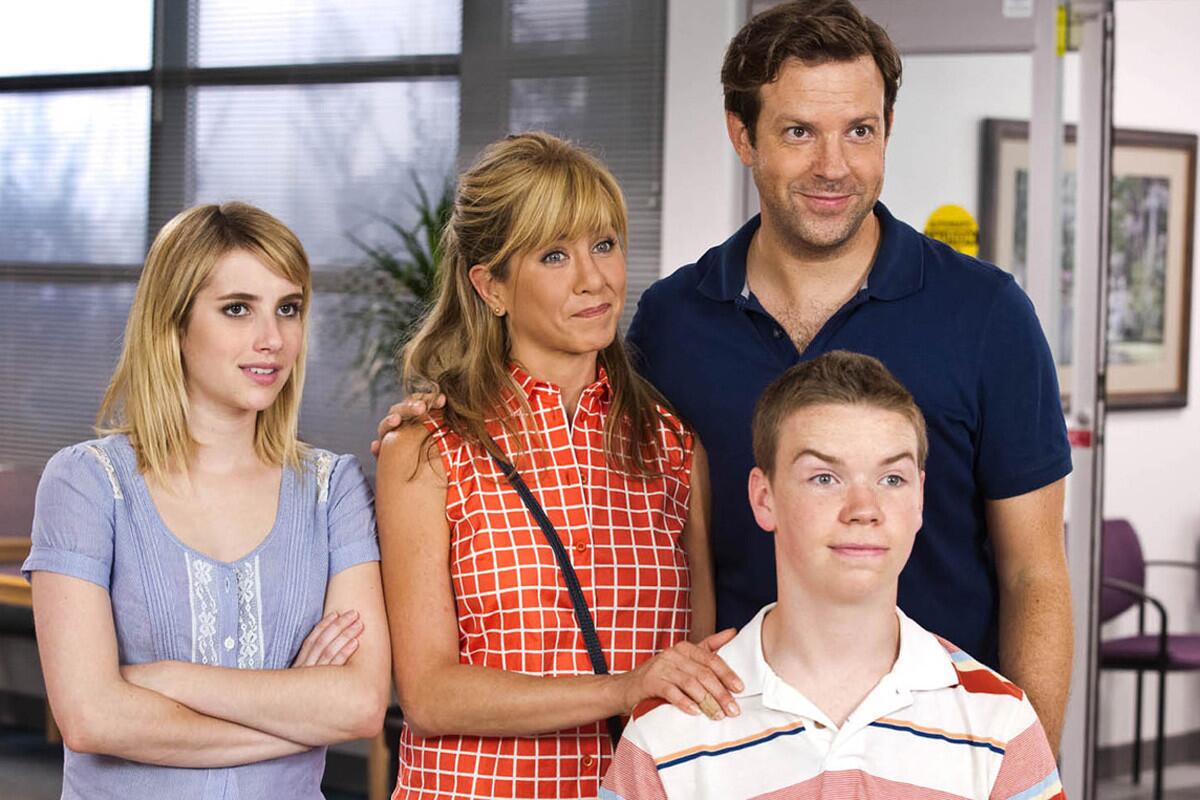 Emma Roberts, left, Jennifer Aniston, Jason Sudeikis and Will Poulter, front, in "We're the Millers." Aniston, Roberts and Poulter won the MTV Movie Award for best kiss on Sunday night.