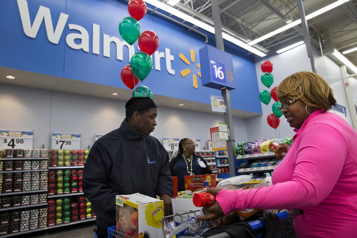 Customers check out at a Wal-Mart in Washington, D.C.