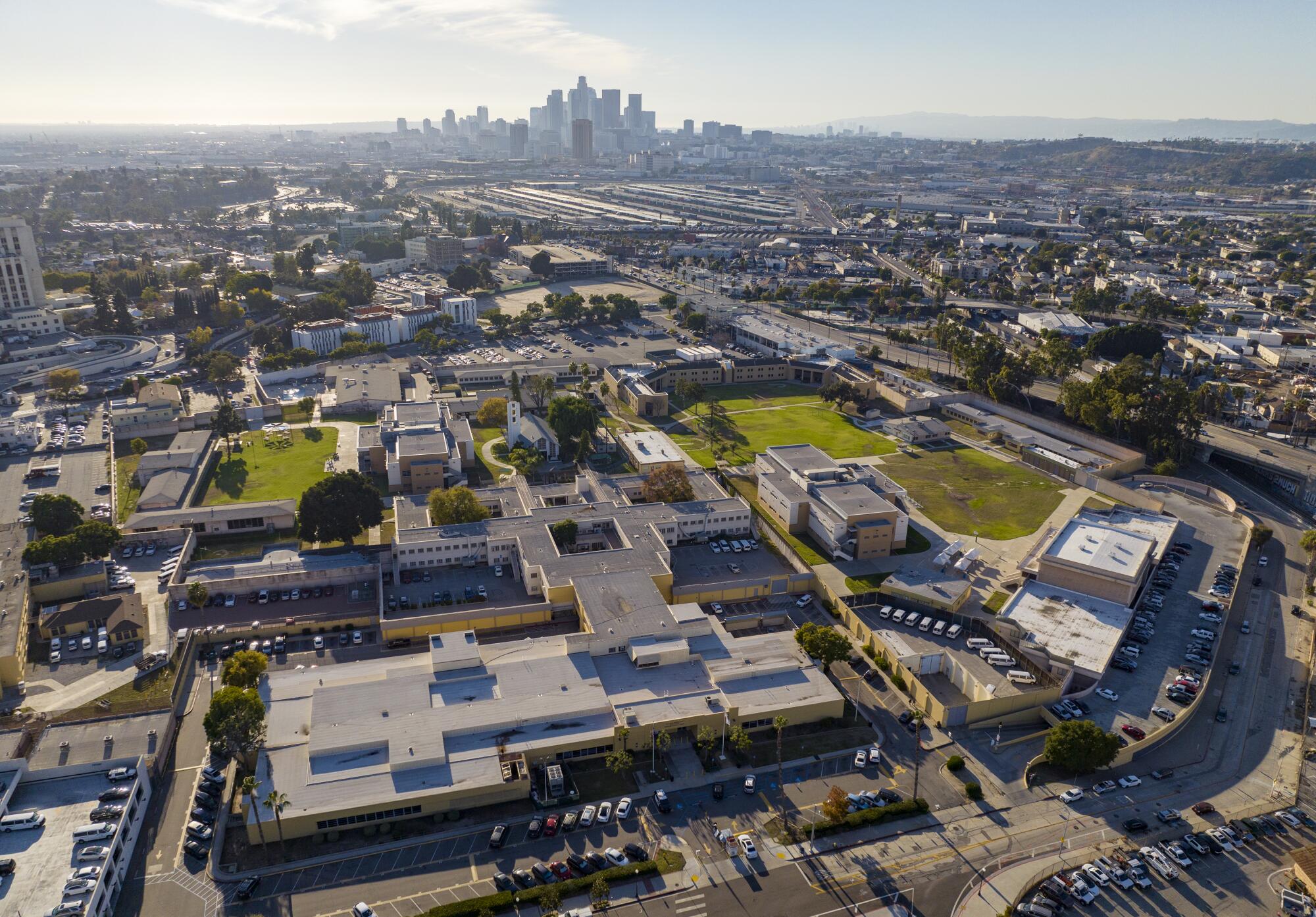 Aerial view of Central Juvenile Hall, foreground, with downtown Los Angeles in the background
