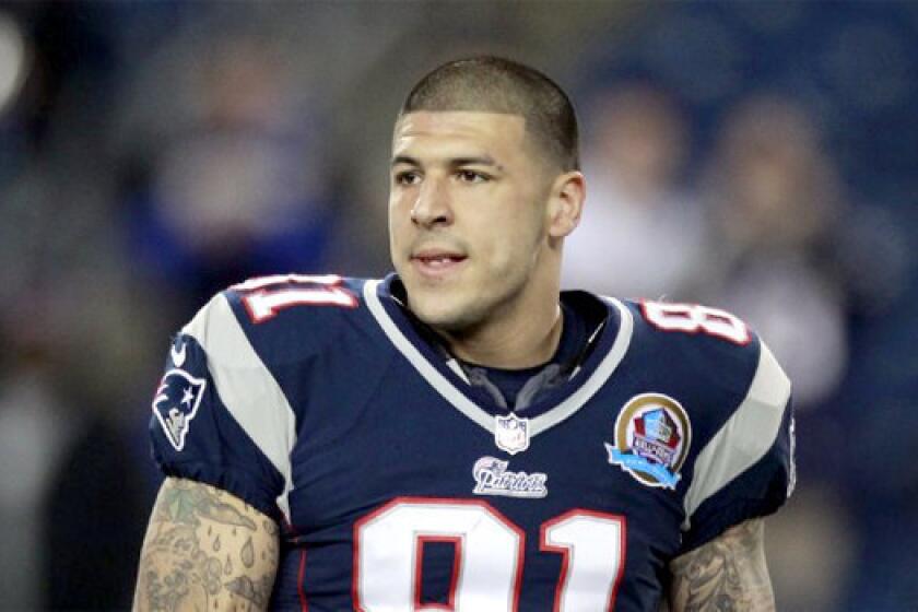 Video footage recorded early Monday morning appears to show Patriots tight end Aaron Hernandez with Odin Lloyd, who was later found dead, according to the Boston Globe which cited two law enforcement officials.
