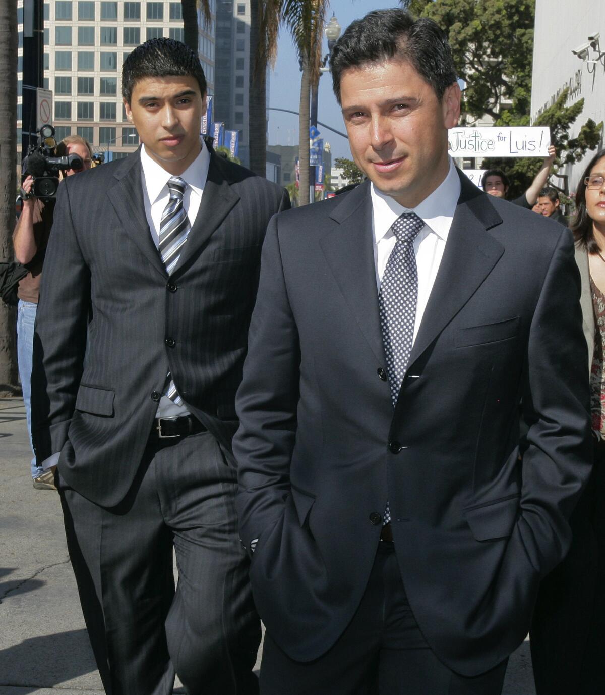 Former Assembly Speaker Fabian Nuñez, right, and his son Esteban Nuñez leave a hearing in Superior Court in San Diego on May 18, 2009.