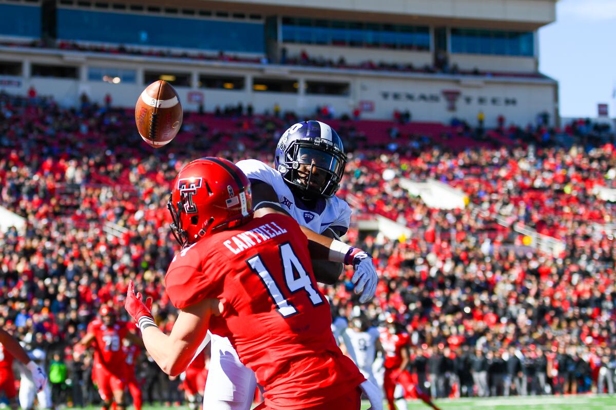 TCU's Jeff Gladney, top, knocks a pass away from Texas Tech's Dylan Cantrell.