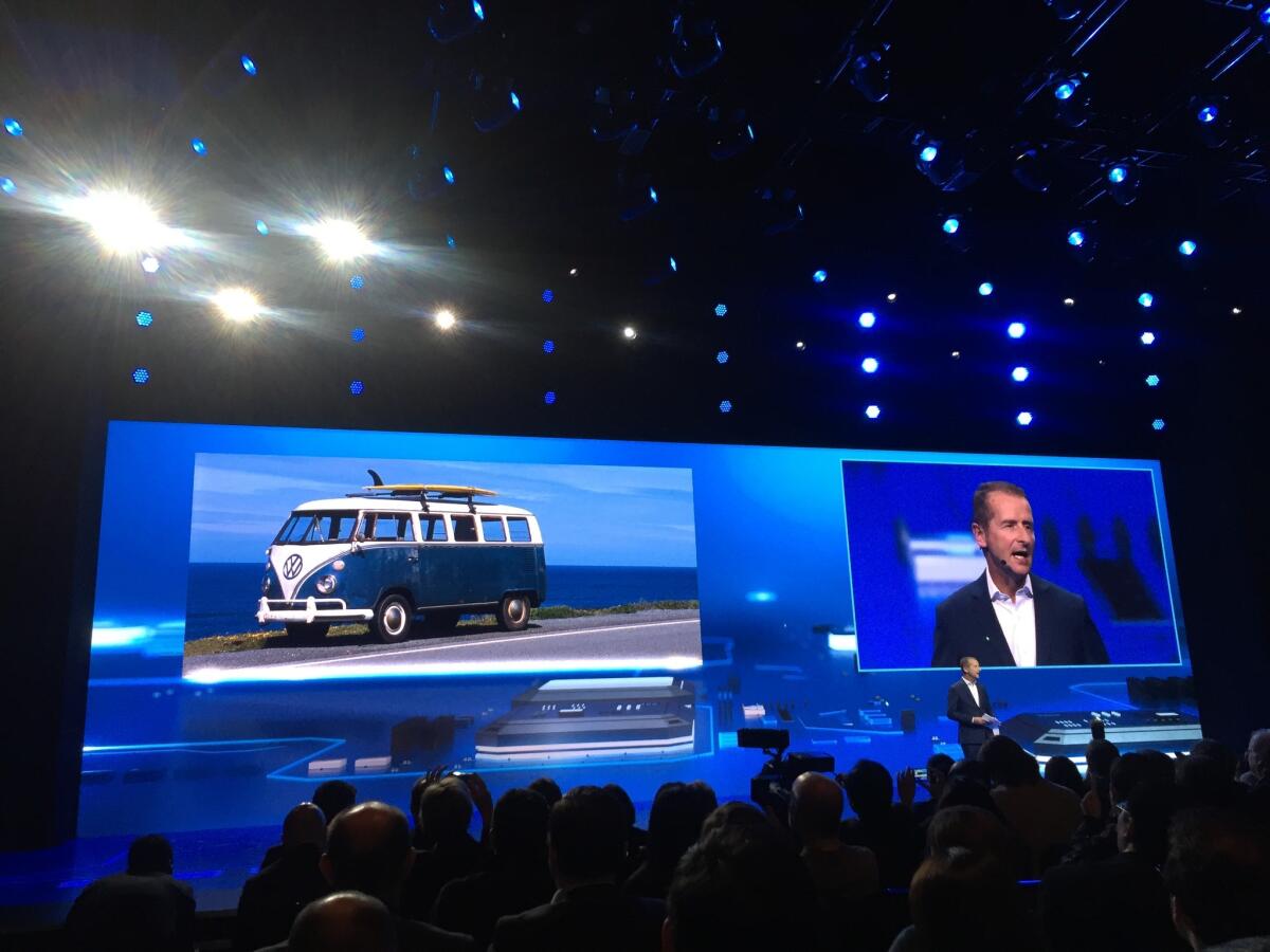 Volkswagen Passenger Cars Chairman Herbert Diess appears on stage at CES on Tuesday night.