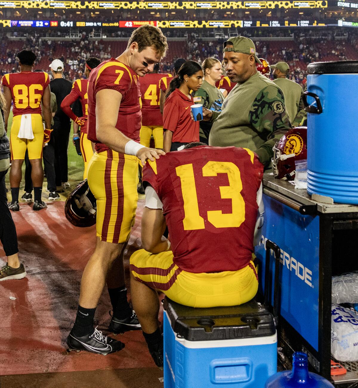 USC backup quarterback Miller Moss, left, consoles quarterback Caleb Williams in the final moments of the Trojans' loss.