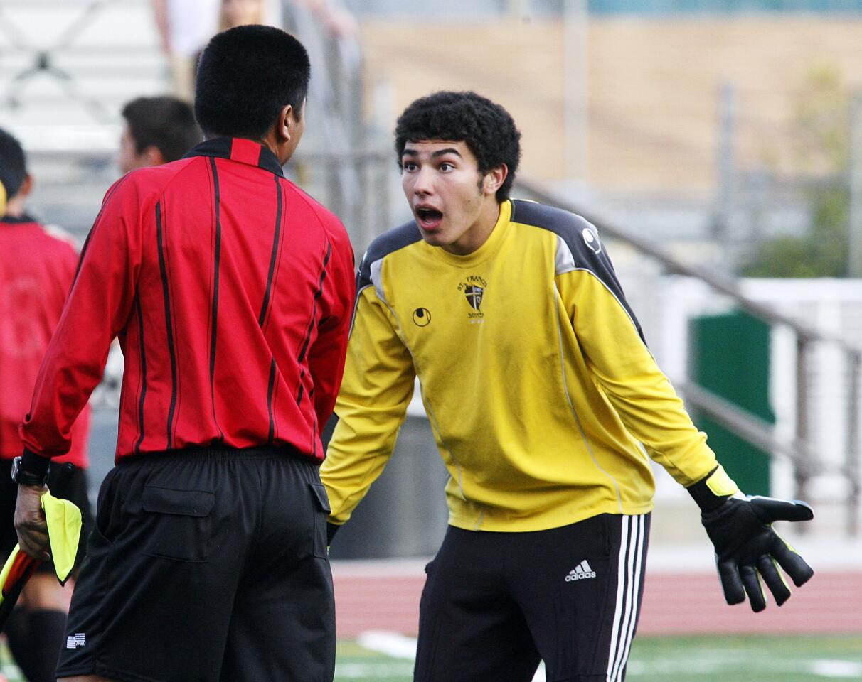 St. Francis' goalkeeper Luca Coppola pleads with the referee after an overtime golden goal was awarded to Ventura for the win in a CIF Southern Section Division I second-round playoff soccer match at St. Francis High School in La Canada Flintridge on Tuesday, February 21, 2012. The ball was heading into the goal and was kicked out by a St. Francis defender, but the assistant referee declared the ball had fully crossed the goal line for a goal. St. Francis lost the match in the first overtime 2-1.